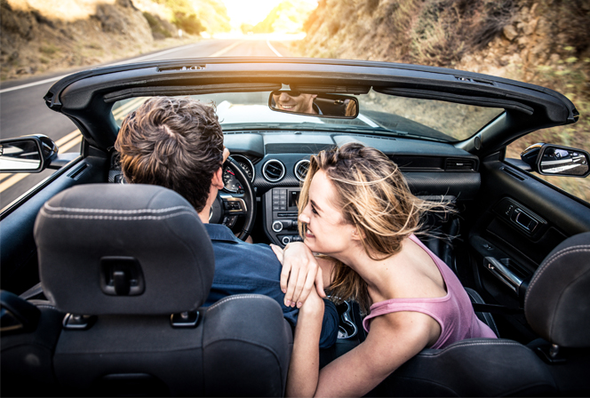attractive couple taking a fun car ride